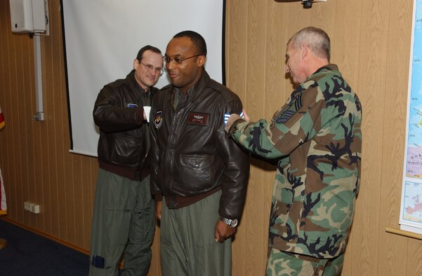 General Johnston and Chief Viel STEP promote Tech. Sgt. James Ewing from the rank of staff sergeant. Photo by Airman 1st Class Levi Riendeau
