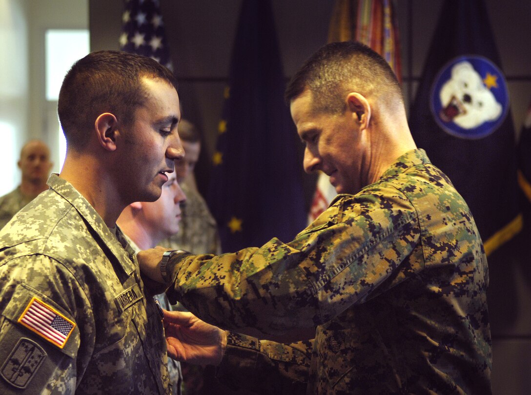 Army Staff Sgt. Michael Barrera has a Silver Star pinned to his uniform by Marine Gen. Peter Pace, chairman of the Joint Chiefs of Staff, during a ceremony at Fort Wainwright, Alaska, Feb. 22, 2007. 