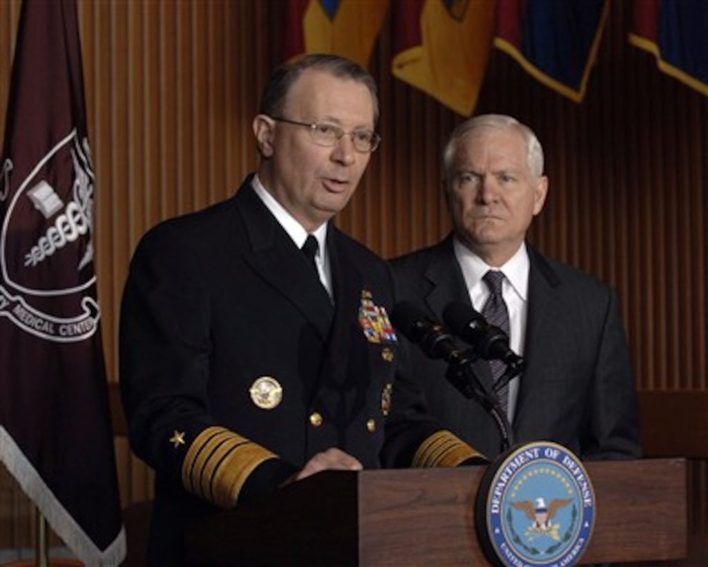Vice Chairman of the Joint Chiefs of Staff Adm. Edmund Giambastiani, U.S. Navy, (left) responds to a reporter's question during a press conference with Secretary of Defense Robert M. Gates (right) following a tour of Walter Reed Army Medical Center in Washington, D.C., on Feb. 23, 2007.  Giambastiani and Gates toured the facilities and met with some wounded troops being treated there.  