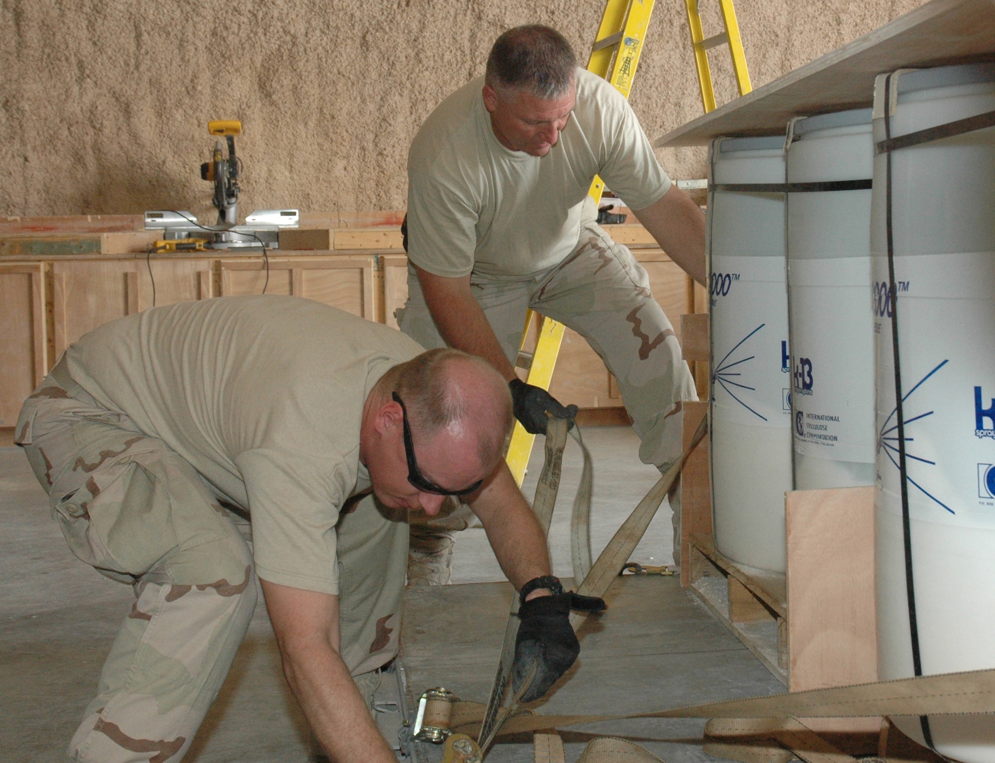 Airmen from the 1st Expeditionary RED HORSE Group palletize supplies to transport to Airmen in forward-deployed RED HORSE units throughout the area of responsibility. (U.S. Air Force photo by Senior Airman Erik Hofmeyer)