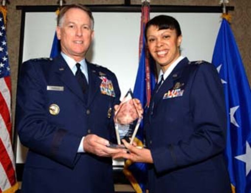 WASHINGTON -- Lt. Gen. John A. Bradley, chief of Air Force Reserve Command, and Col. Stayce Harris, 459th Air Refueling Wing commander, hold the AFRC and 4th Air Force 2006 Effective Maintenance Award. Colonel Harris accepted the award on behalf of the 459th Maintenance Squadron. General Bradley presented the award at the Senior Leadership Conference in Washington Feb. 6. (U.S. Air Force photo/Staff Sgt. Amaani Lyle)