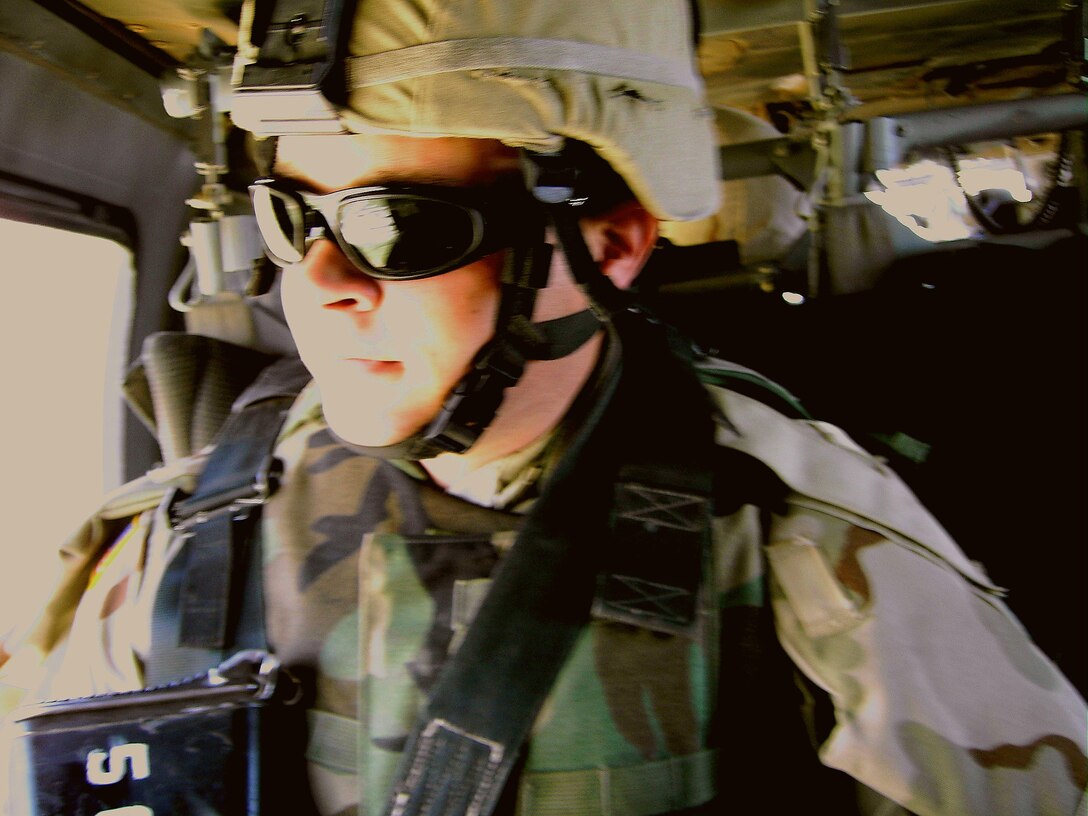 Army Spc. Ryan Leach takes a helicopter flight while on duty in Iraq with the 545th Military Police Company, Fort Hood, Texas.  Leach recently returned to his home Mount Pleasant, S.C., as part of the Army Special Recruiter Assistance Program where he spent two-week talking people in the community, especially students, about his experiences. Courtesy photo