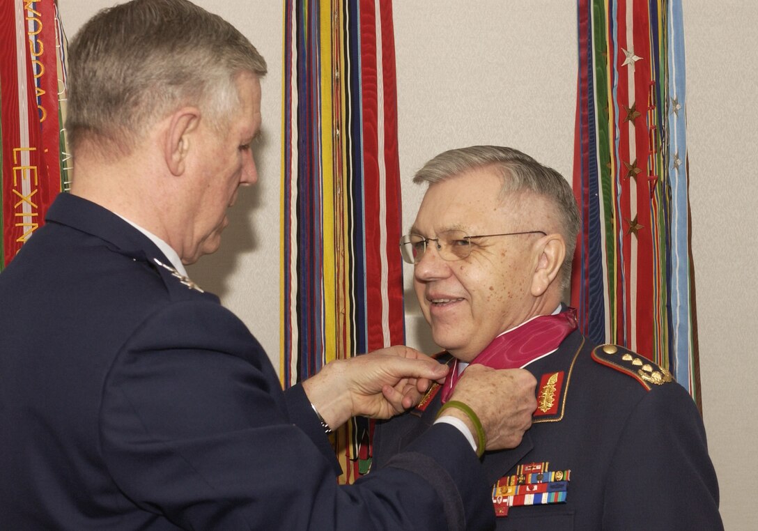 Air Force Gen. Richard B. Myers, chairman of the Joint Chiefs of Staff, awards the Legion of Merit to German Federal Armed Forces Gen. Harald Kujat at the Pentagon on April 7. Kujat received the medal for his work with the North Atlantic Treaty Organization and the Federal Republic of Germany. Photo by Staff Sgt. D. Myles Cullen, USAF          
