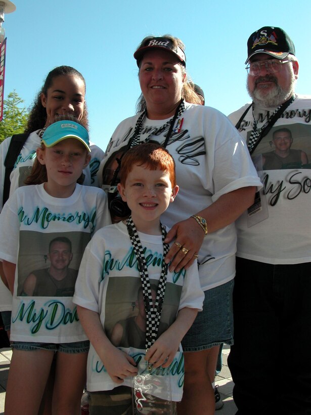 The family of Army Pfc. Stephen Paul Downing II, who was killed in Ramadi, Iraq, Oct. 28, 2004, gathers before being seated. Pictured are Downing's children, Hunter, 6, and Taylor, 9; his niece, Chelsea, 11; Downing's sister, Danica; and his father, Stephen.. Several families who lost loved ones in Iraq and Afghanistan were provided free tickets to the Indy 500, held May 29 at the Indianapolis Motor Speedway.  Photo by Sgt. 1st Class Doug Sample, USA
