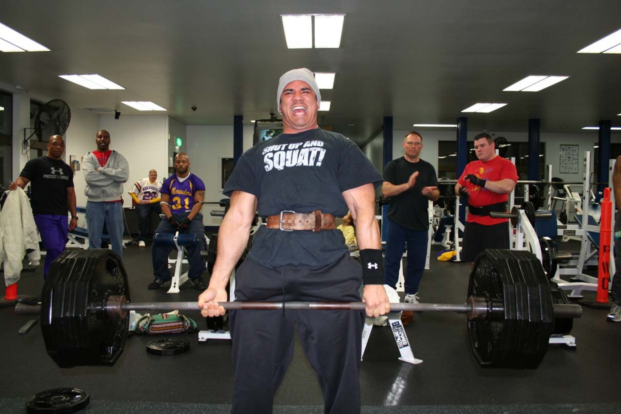 070217-- MISAWA AIR BASE, Japan -- Staff Sgt. Joe Green, 35th Medical Support Squadron, lifts a total weight of 750 pounds during a weight lifting competition here at the Potter Fitness Center Feb. 17. Eighteen contestants competed in the bench press and dead lift in light, medium, and heavy weight divisions. (Courtesy photo)