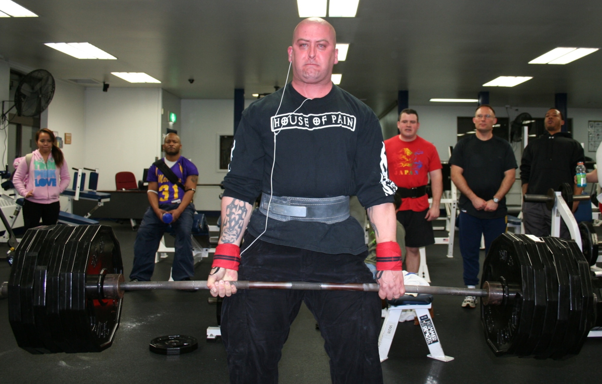 070217-- MISAWA AIR BASE, Japan -- Staff Sgt. Christopher Smith, 35th Logistics Readiness Squadron, lifts a total weight of 910 pounds during a weight lifting competition here at the Potter Fitness Center Feb. 17. Eighteen contestants competed in the bench press and dead lift in light, medium, and heavy weight divisions. (Courtesy photo)