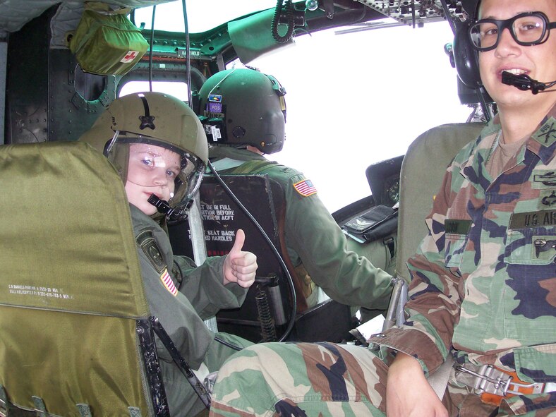 CAMP RUDDER, Fla. -- Riley Woina, 14, from Connecticut, prepares for take-off in a UH-1V Huey air ambualnce from the 5th Aviation Battalion from Ft. Polk, La., here Feb. 21. Riley, diagnosed with cystic fibrosis, was granted a week with the 6th Ranger Training Battalion and Eglin Airmen through the Make-A-Wish Foundation Feb. 19-24. (U.S Army photo by Army Capt. Jeremiah Cordovano)