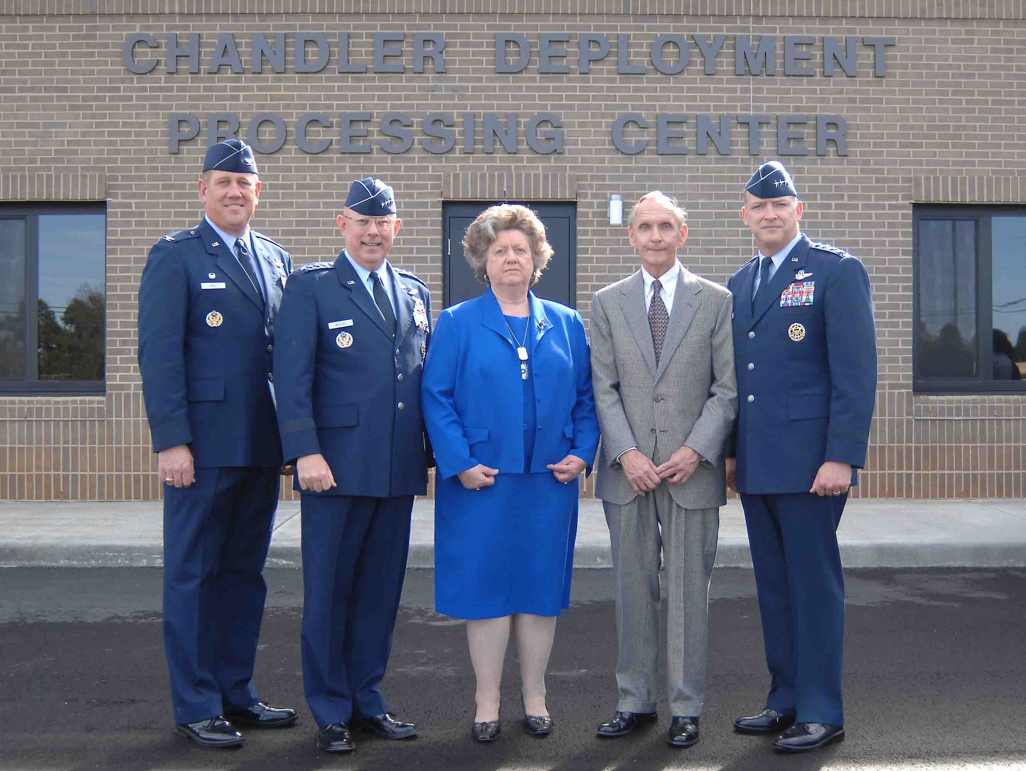 SHAW AIR FORCE BASE, S.C. -- From left, Col. James Hyatt, 20th Fighter Wing commander; Gen. T. Michael Mosley, Air Force chief of staff; Anna and Archie Chandler, and Lt. Gen. Gary North, 9th Air Force and U.S. Central Air Forces commander, stand in front of the Chandler Deployment Processing Center after the dedication ceremony Feb. 26. The Chandler Deployment Processing Center stands as a testament to the Chandlers' faithfulness and dedication to our Airmen performing the Air Force's mission at home and abroad, Colonel Hyatt said during the ceremony. The 40,500-square-foot building includes a state-of-the art mobility bag storage system for more than 10,000 bags, a mechanized weapons storage vault and a passenger holding area for up to 300 people. (U.S. Air Force photo/Airman Mathew Davis)