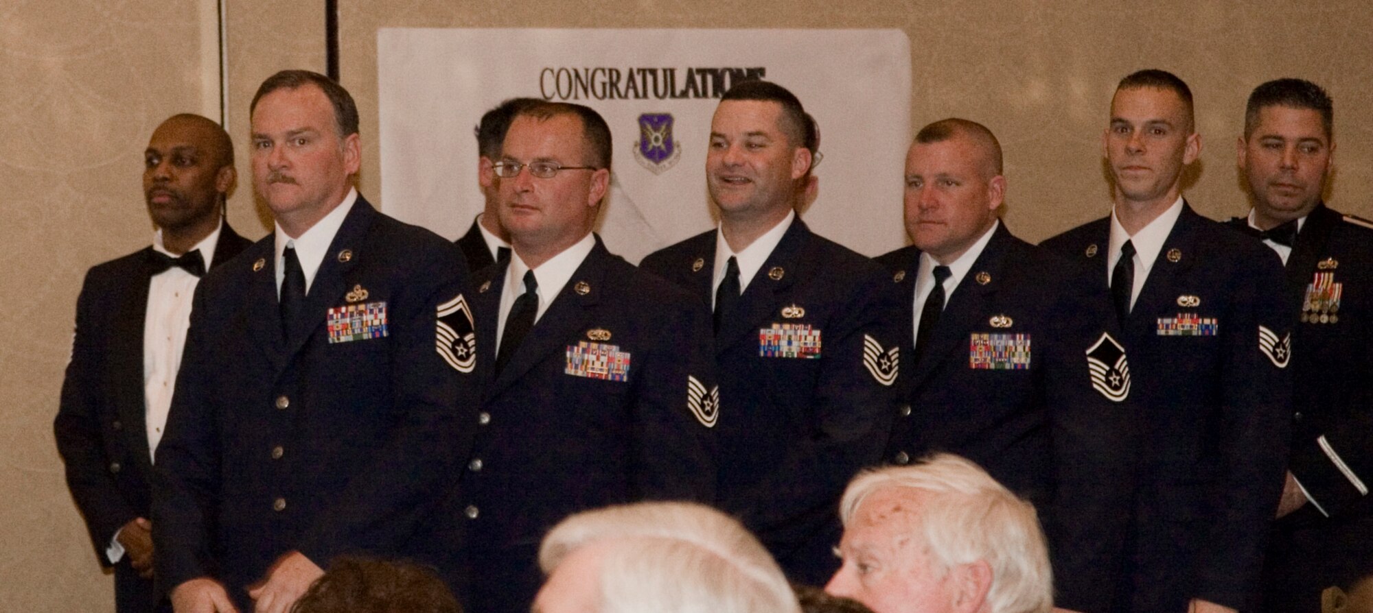 (second from the left to right) Senior Master Dennis Walters, Tech. Sgt. Mike Donnelly, Tech. Sgt. Todd Sigler, and (following Master Sgt. Nathan Robin, Henry D. Green winner) Staff Sgt. Jeffrey Powers wait to receive their Air Force Ground Safety Well Done award on stage. Ten major awards were presented by Col. Kevin Pottinger, 301st Fighter Wing commander, with numerous other recognitions announced throughout the evening's event. (U.S. Air Force Photo/Staff Sgt. Jason Costantino)