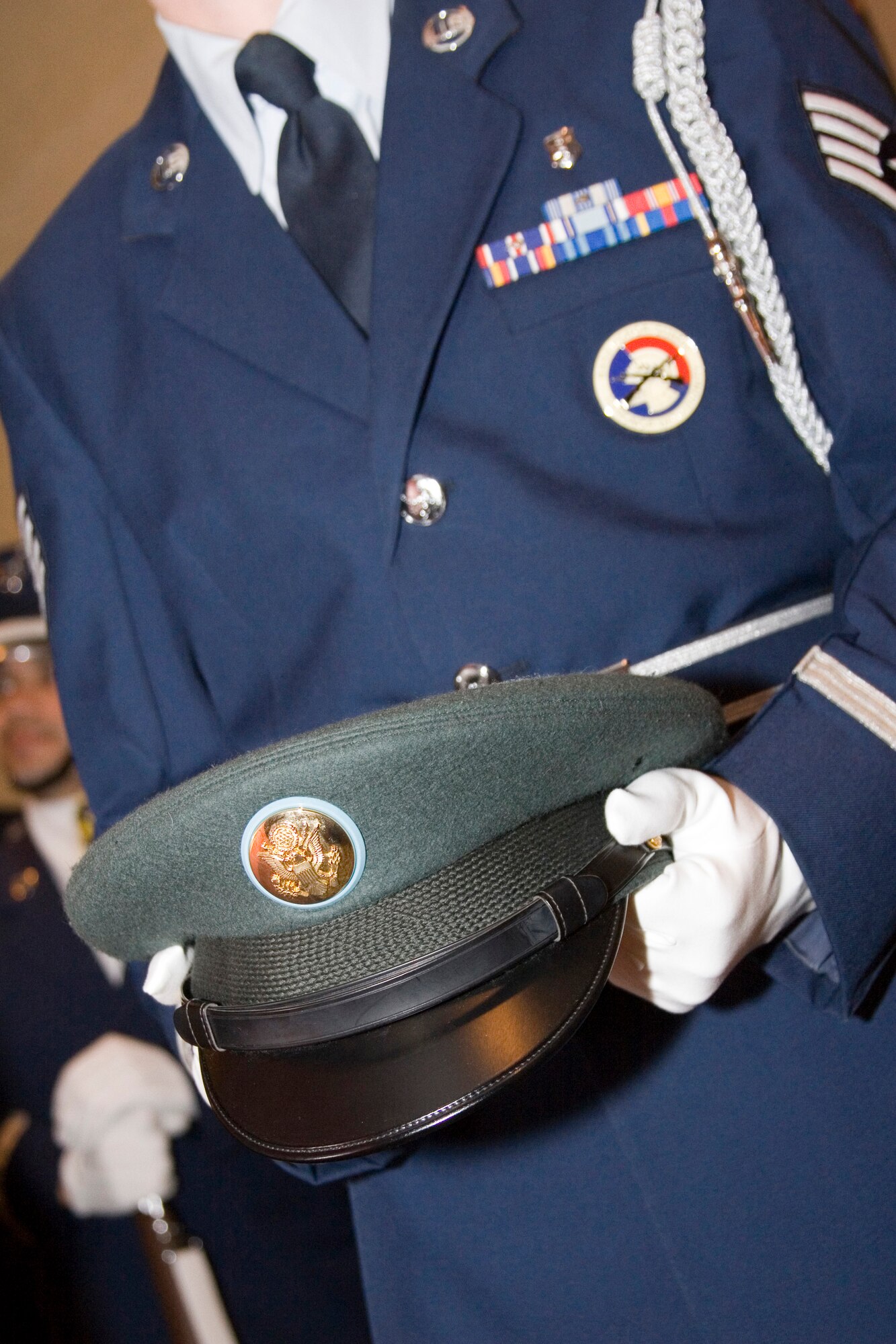 Joint Service Honor Guard members presented the different service caps for placement on the POW/MIA table, a somber rememberance to those who have given the ultimate sacrifice for their country. The Honor Guard drill team also performed an awe-inspiring rifle precision performance for the audience. (U.S. Air Force Photo/Staff Sgt. Jason Costantino)