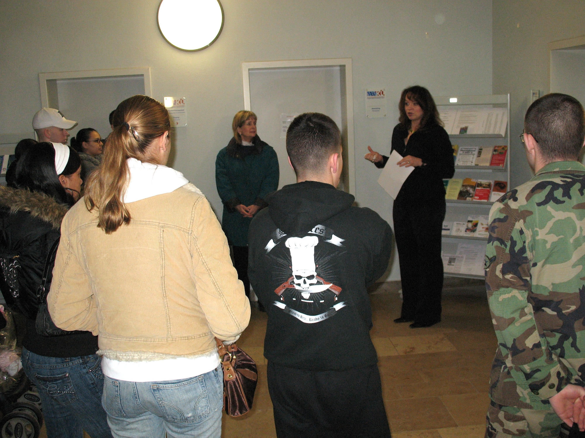 The German-American Comminuty Office staff brief newcomers during a USO tour of the Kaiserslautern area. The GACO members explain to the newly relocated where to find the GACO office and get information on the services the GACO offers. With over 50,000 Americans stationed in the Kaiserslautern area the GACO sees a high volume of customers. (U.S. Air Force Photo/Staff Sgt. Greg Bluethmann)