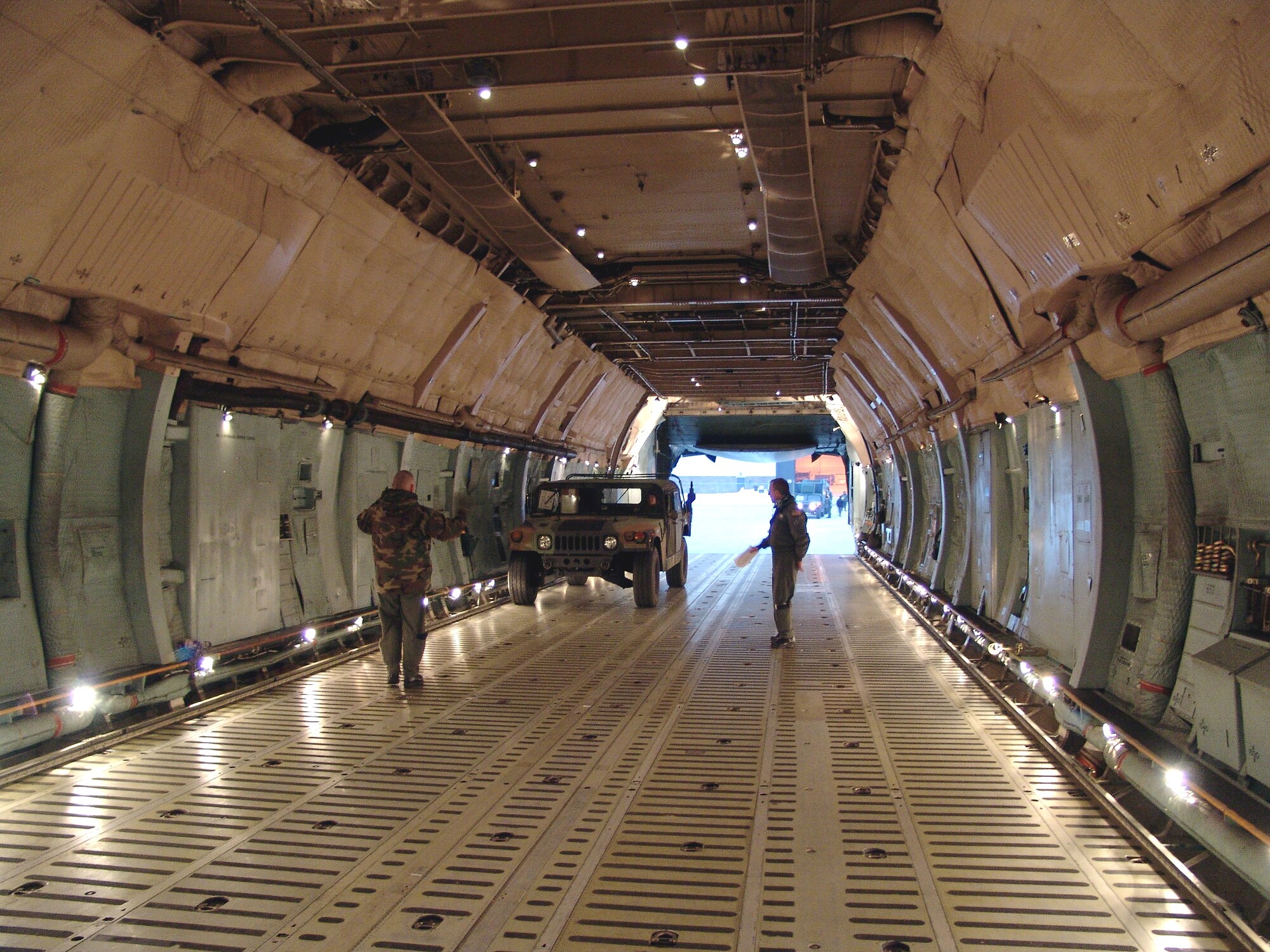 GRISSOM AIR RESERVE BASE, Ind., -- Aircrews load members of the 17th Psycological Operations Battallion and their equipment onto a C-5 Galaxy at Grissom recently. The battallion deployed for a short exercise with the help of the base's 49th Aerial Port Flight. The Illinois Army Guard unit is based out of Joliet, Ill. The 49th APF loaded 11 pieces of rolling stock that weighed 82,526 pounds onto the aircraft. (U.S. Air Force photo)