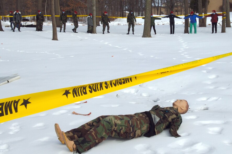 HANSCOM AFB, Mass. -- The Hanscom Search and Recovery Team line up to start the search pattern during Search and Recovery training by the Air Force Research Laboratory Hanscom site on Feb. 20. The line progresses one step at a time until the area has been searched and then turn 90 degrees to cross-sweep the area. (U.S. Air Force photo by Jan Abate)