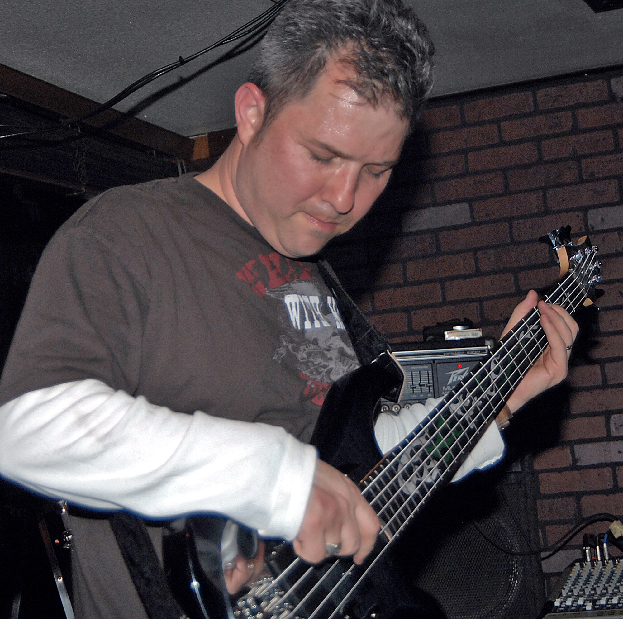 Master Sgt. Lawrence D. Willingham, 58th Training Squadron, plays bass at a recent show in Albuquerque with the band Missing Stateside. Sergeant Willingham and Tech. Sgt. J.D. Morgan are both Airmen stationed here and reformed the band after they moved to Kirtland. (U.S. Air Force photo by Adam Wooten)