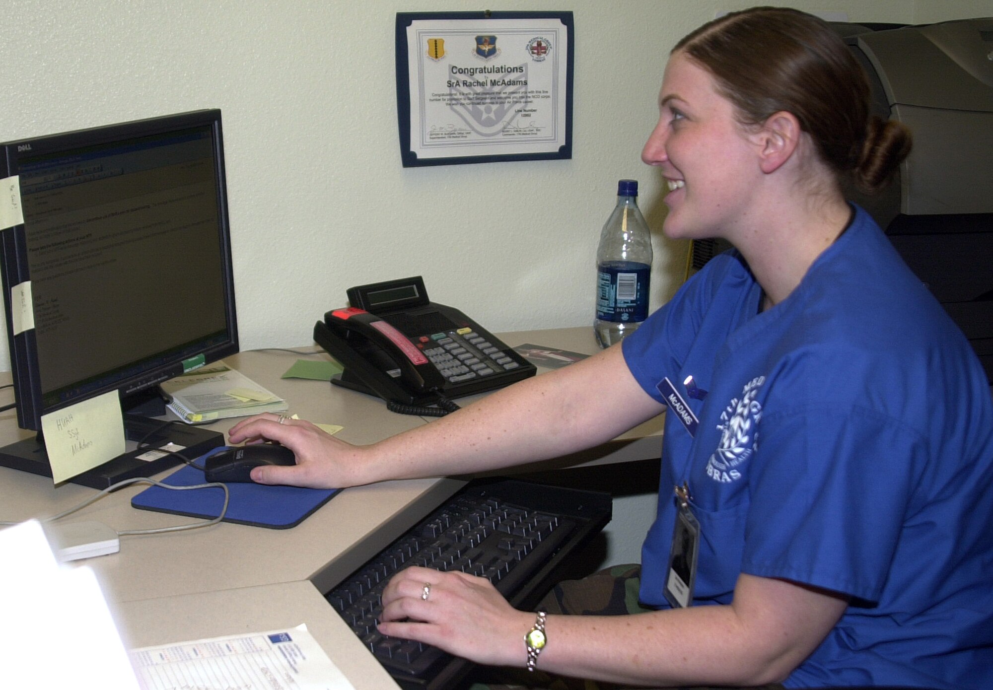 Senior Airman Rachel McAdams works hard at her computer Tuesday. Airman McAdams is a commander’s support staff technician with the 17th Medical Group. Hanging on the wall behind her is her line number for staff sergeant.