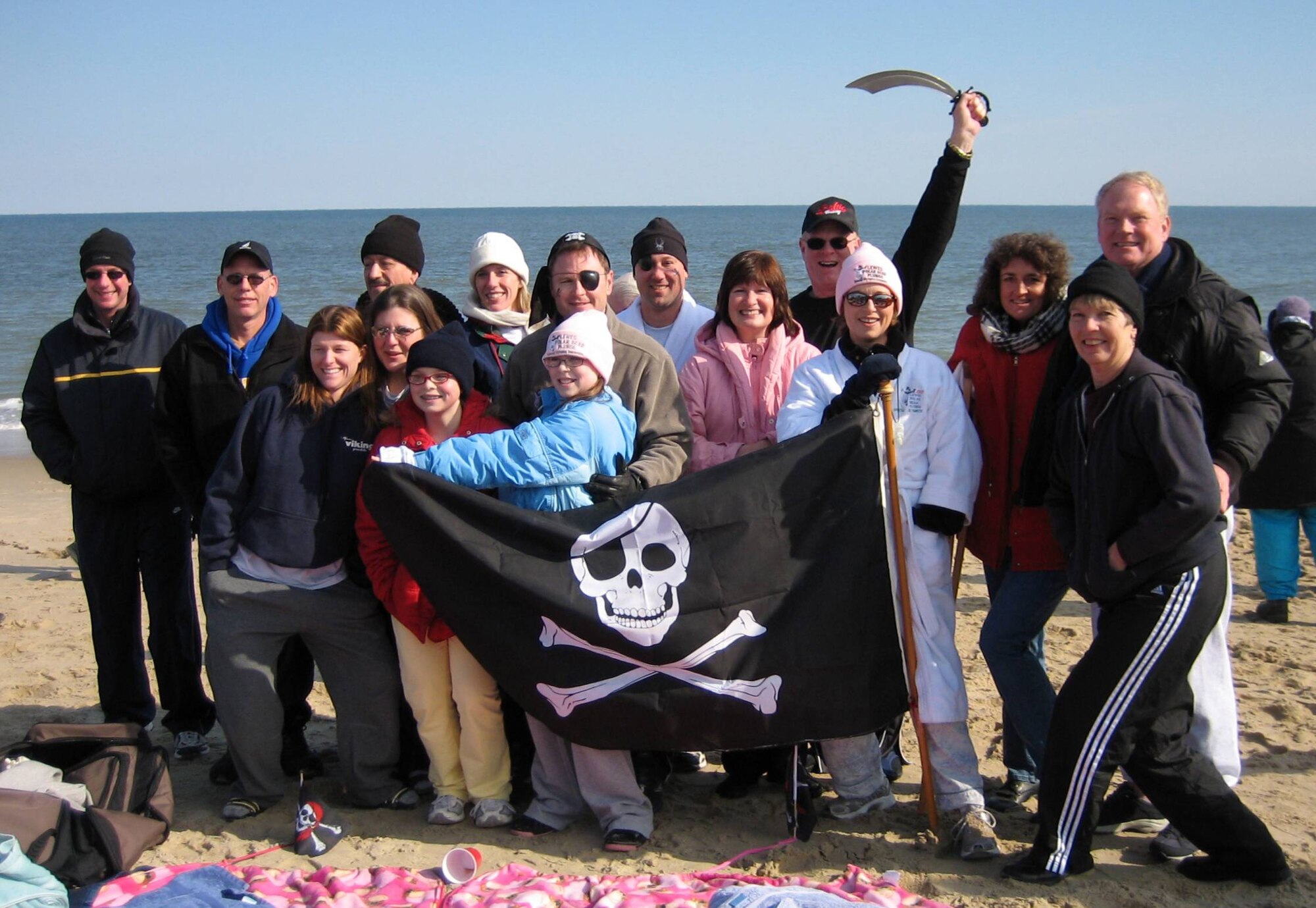 The Shiver Me Timbers Polar Bear Plunge team was comprised of several 512th Airlift Wing members, who helped raise $10,000 for Special Olympics Delaware. They plunged into the ocean at Rehoboth Beach Feb. 4 when the air temperture was at 29 degrees, the third coldest in plunge history. Liberty Wing members included Lt. Col. Diego Alvarez, Col. (Ret.) Don Sloan, Lt. Col. Louis Patriquin, Maj. Kyle Pangle, 1st Lt. Kelly Mount, Senior Master Sgt. Bill Clifton and their family and friends. The 512th Airlift Wing is an Air Force Reserve Command unit at Dover Air Force Base, Del. (U.S. Air Force photo)    