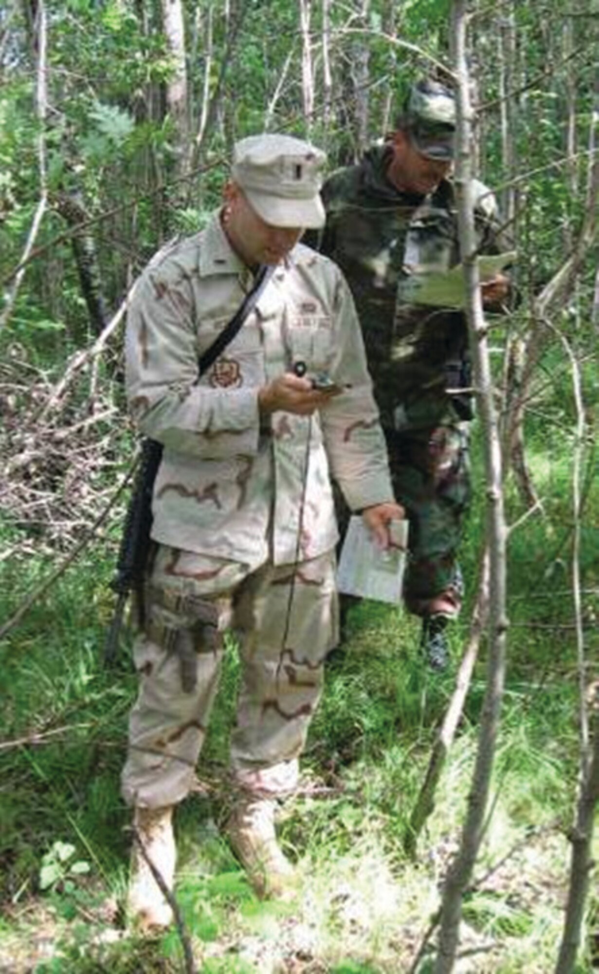 Lt Ryan Rickert and MSgt James Myer shoot an azimuth during LANDNAV