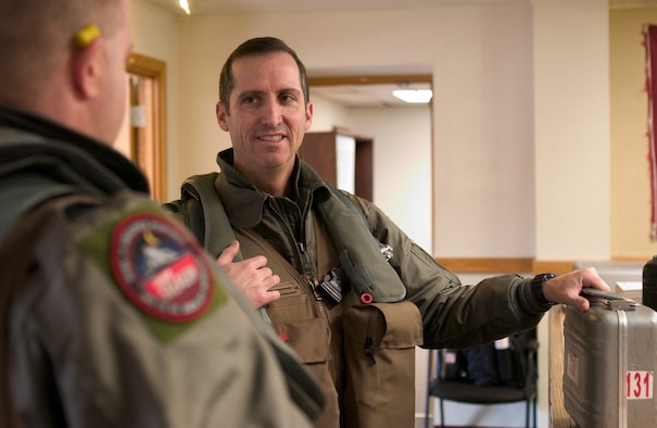 KUNSAN AIR BASE, Republic of Korea Feb. 28, 2007 -- Col. Jack Forsythe (center), 49th Operations Group commander from Holloman Air Force Base, N.M., talks with a fellow F-117 pilot prior to a weather briefing Feb. 28. Col. Forsythe visited the Wolf Pack for about a week, getting familiarized with the beddown of the F-117 stealth fighter as well as seeing the living conditions the Holloman Airmen were in.