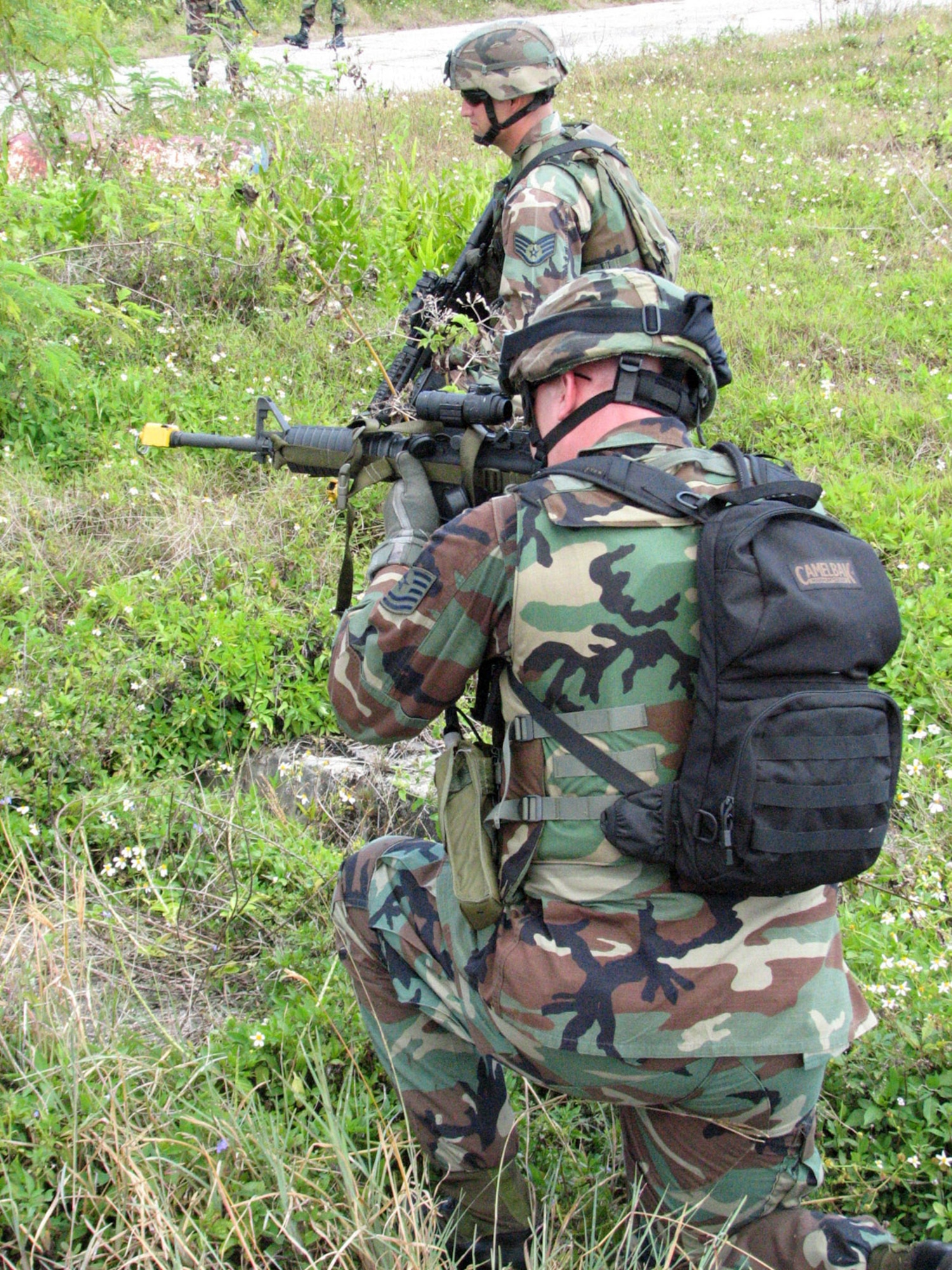 An Airman peers down the sight of his M4 rifle Feb. 26 during training at Andersen Air Force Base, Guam,. Airmen from the 36th Contingency Response Group participated in a series of battle drills to hone their combat skills. (U.S. Air Force photo/Army Sgt. Catherine Talento)