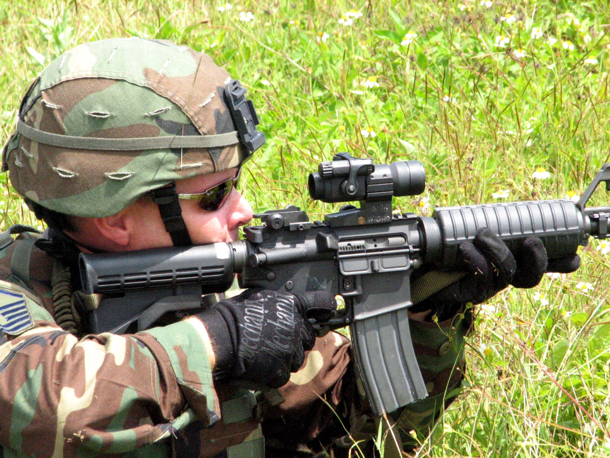 An Airman lays down suppressive fire during training Feb. 26 at Andersen Air Force Base, Guam. Airmen from the  36th Contingency Response Group were participating in a combat drill course. (U.S. Air Force photo/Army Sgt. Catherine Talento)