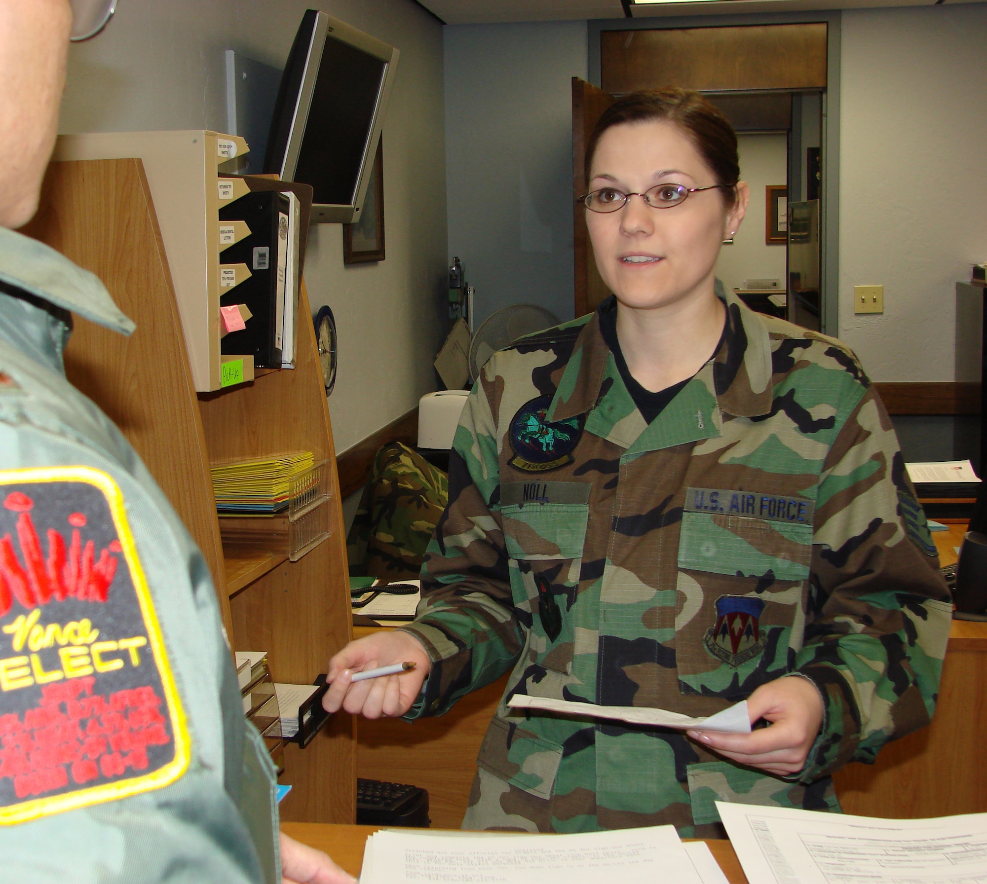 Staff Sgt. Heidi Noll, 71st Operations Group support program NCO in charge, assists a student pilot with in-processing paperwork. Sergeant Noll was recently selected as the Vance Warrior of the Month.  (U.S. Air Force Photo By Frank A. McIntyre)