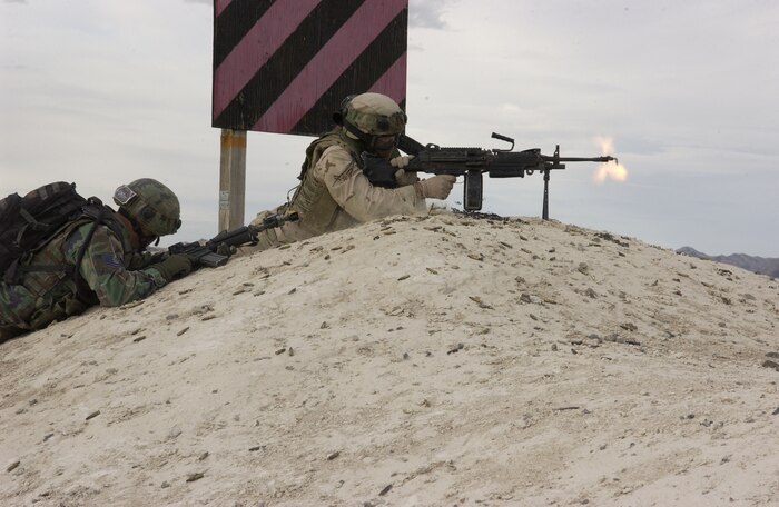 Airmen 1st Class Nickolas Hurst, 509th Security Forces Squadron, Whiteman Air Force Base, Mo., engages the enemy during a simulated deployment convoy mission at a Ground Combat Training Squadron exercise at Creech AFB, Nev., on Feb. 18, 2007. The Ground Combat Training Squadron is responsible for training and testing security forces personnel on procedures for real-world scenarios that they will encounter during a deployment.  (U.S Air Force Force photo by Airman 1st Class Nadine Y. Barclay)

