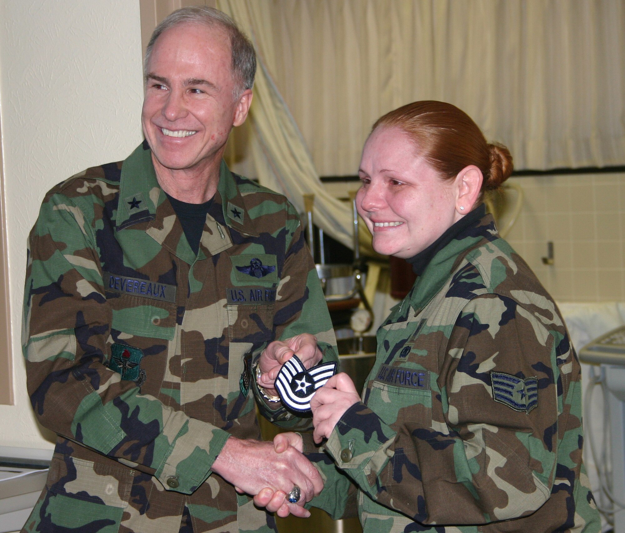 Staff Sgt. Holly Long, a physical education instructor for the 382nd Training Squadron, accepts her STEP promotion to technical sergeant from 82nd Training Wing commander Brig. Gen. Richard Devereaux. (U.S. Air Force photo/Staff Sgt. Tonnette Thompson)