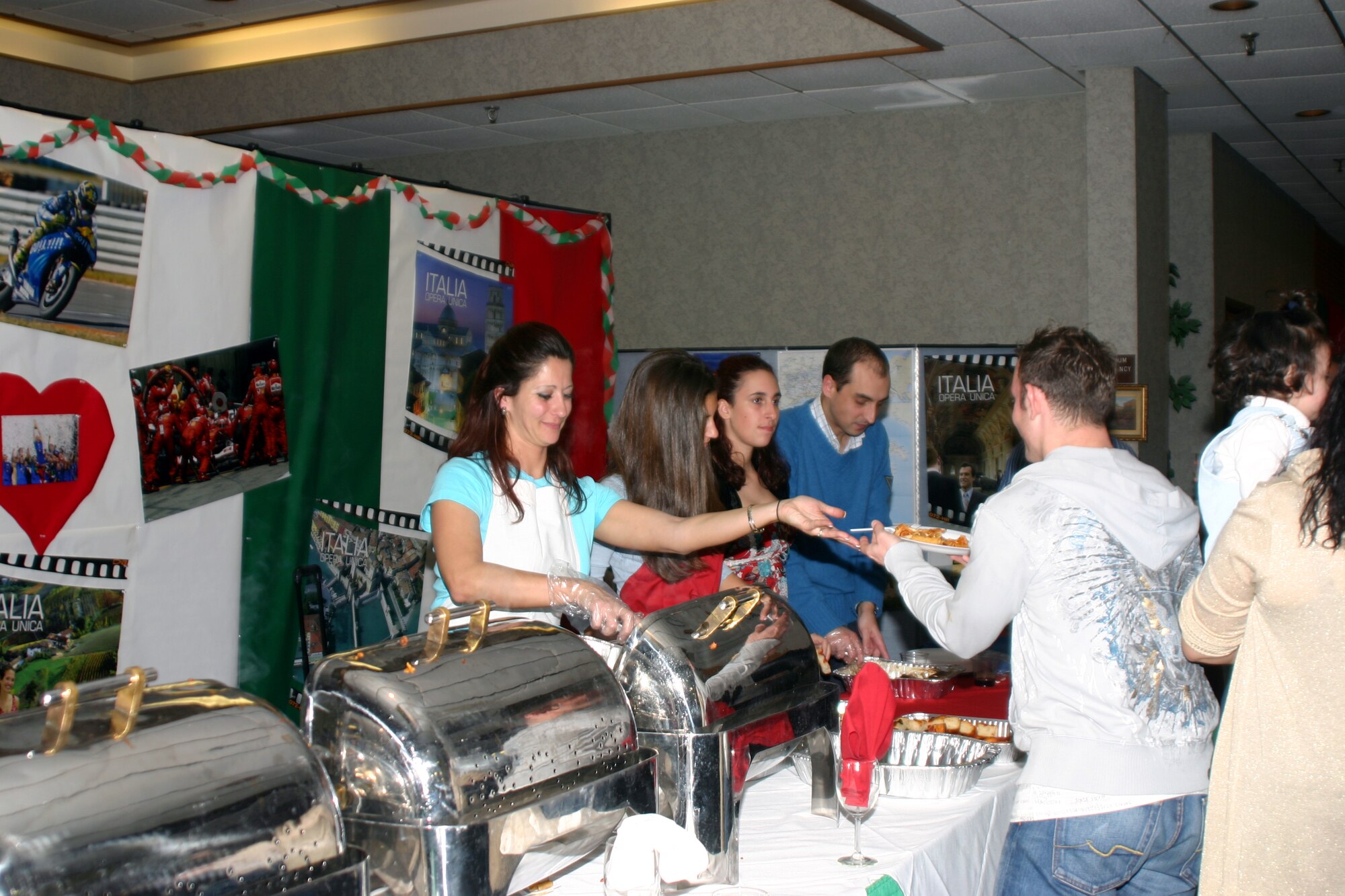 Volunteers for the Around the World Celebration serve up Italian cuisine at the Sheppard Club Feb. 24. (U.S. Air Force Photo/Staff Sgt. Tonnette Thompson)