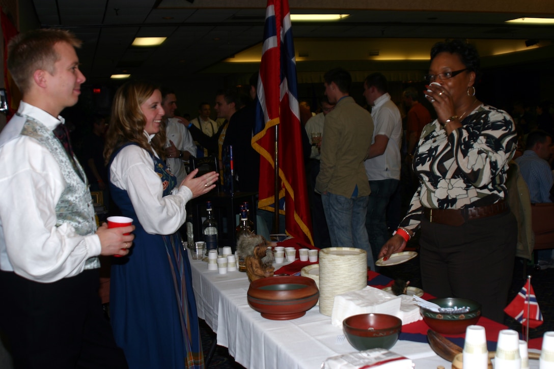 "Aquavit," a Norwegian drink derived from potatoes, is offered to attendees for the Around the World Celebration at the Sheppard Club Feb. 24. (U.S. Air Force Photo/Staff Sgt. Tonnette Thompson)