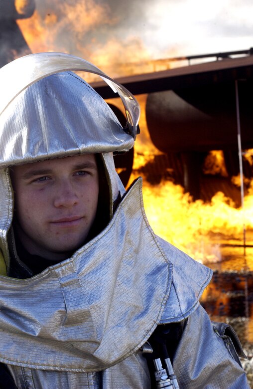 Senior Airman Keith Armour, a firefighter from the 30th Civil Engineer Squadron on Vandenberg, takes a quick break before going back to training during a base excercise on Feb. 13. Airman Armour just recently got back from a deployment in Iraq where he used this training in real-world situations. (U.S. Air Force photo by Airman Jonathan Olds)