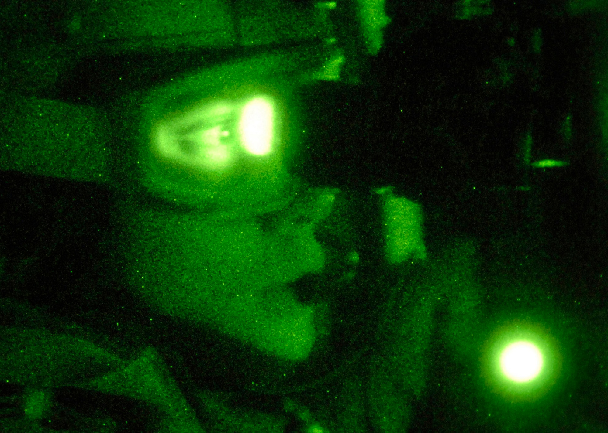 Pararescue jumper Staff Sgt. Eric Kelly scouts for enemy combatants during a combat search and rescue rehearsal mission outside Feb. 24 outside Balad Air Base, Iraq. Sergeant Kelly is assigned to the 64th Expeditionary Rescue Squadron. (U.S. Air Force photo/Tech. Sgt. Cecilio M. Ricardo Jr.)
