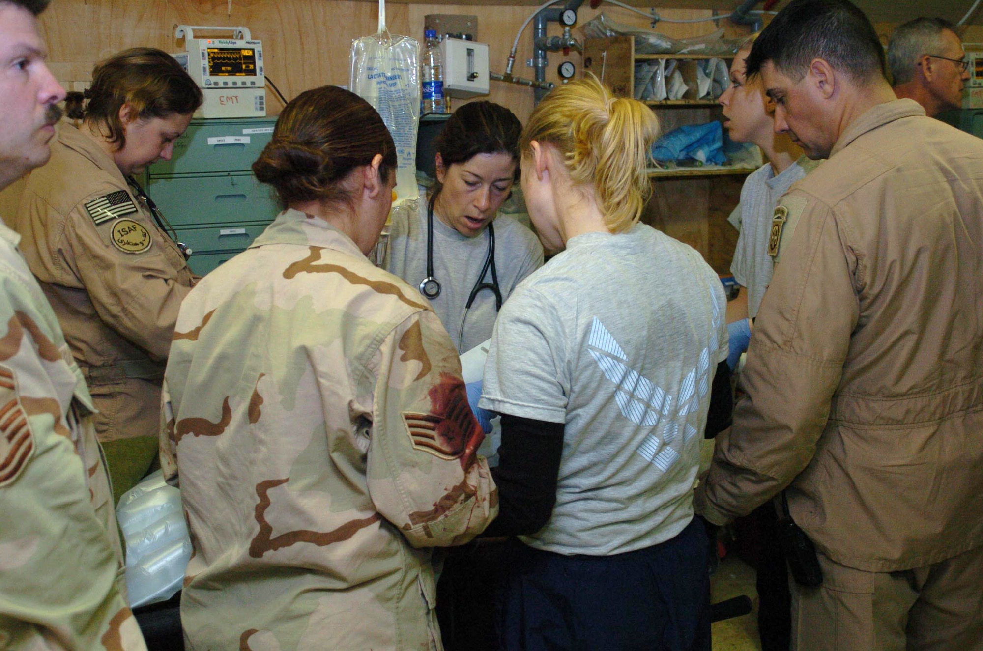 Doctors and nurses at Task Force Med administer life-saving measures on a boy caught in the blast of a suicide bomber's attack Feb. 27.  Vice President Dick Cheney was visiting Bagram Air Base, Afghanistan, when a suicide bomber self-detonated outside a base entry control point.  (U.S. Air Force photo/Staff Sgt. Thomas J. Doscher)