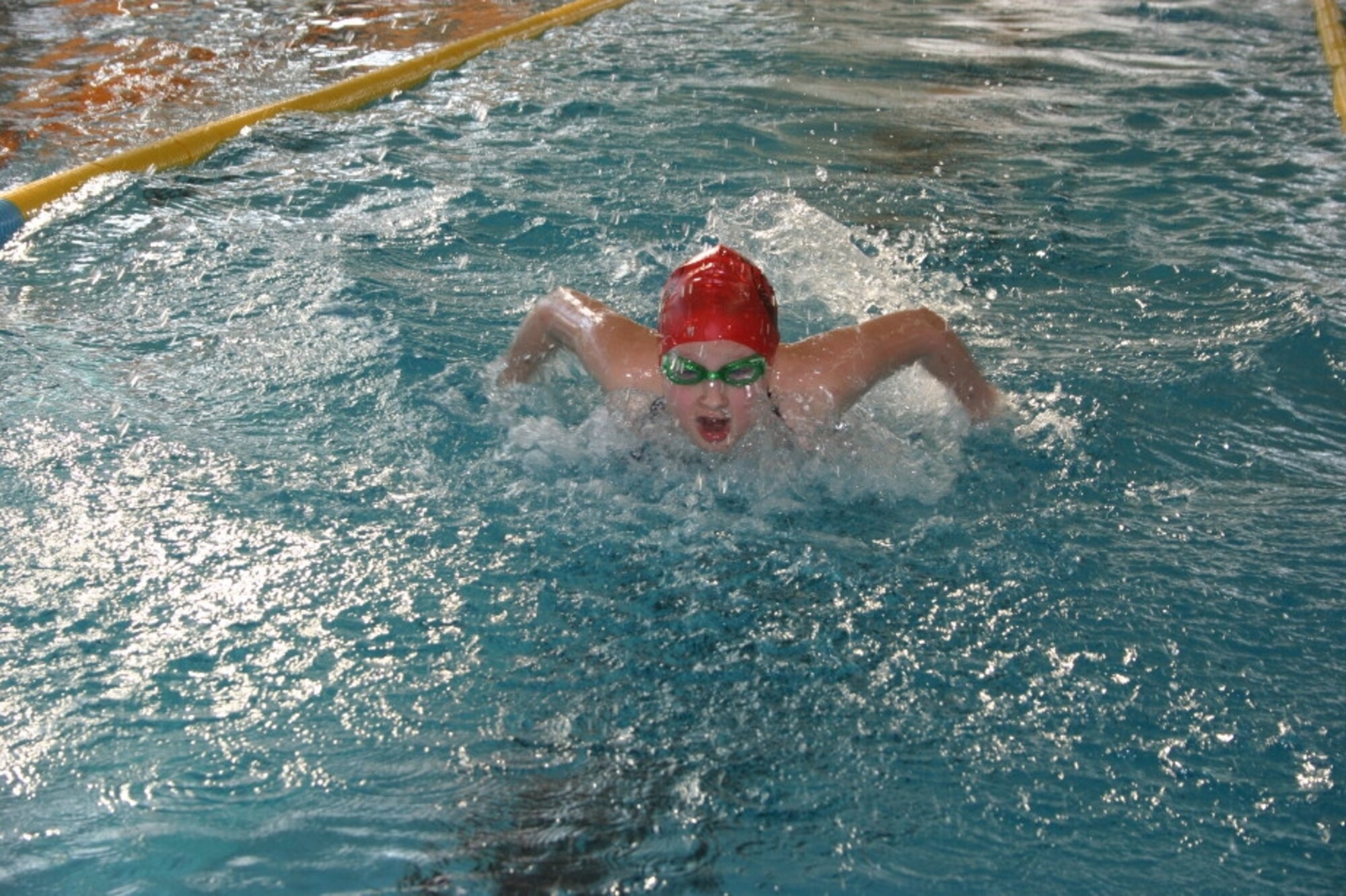Haley McWilliams, 11years old, daughter of Maj. Tim and Tracy McWilliams, swims the butterfly during her leg of the 4x50 meter medley relay.  The relay team placed third at the European Forces Swim League championships in Munich. (Photo courtesy of Virginia Silveria)