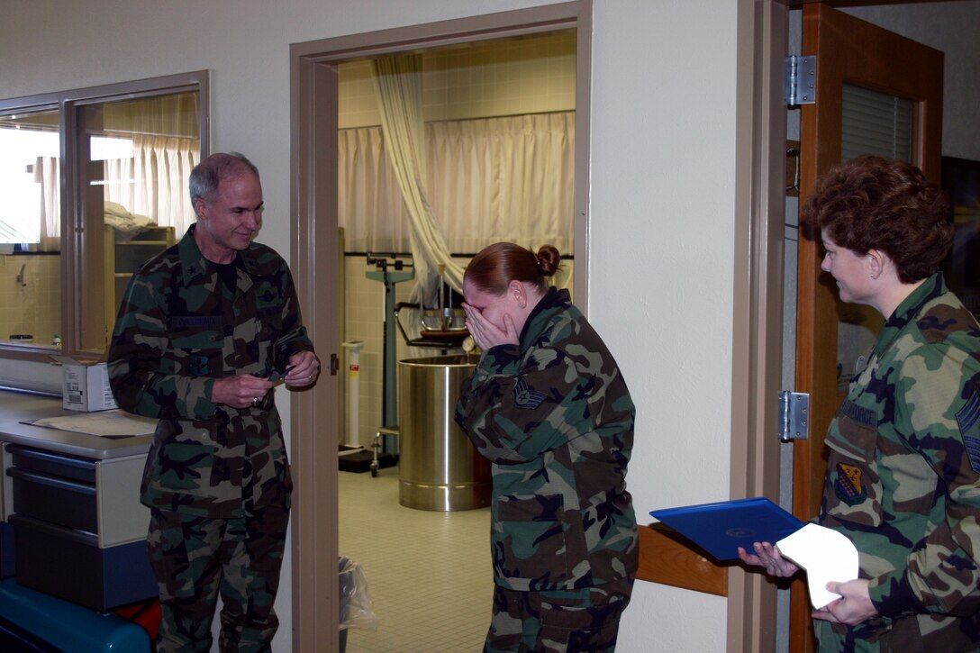 Staff Sgt. Holly Long, a physical education instructor for the 382nd Training Squadron, was STEP-promoted to technical sergeant Feb. 26.  With her students looking on, Tech. Sgt. Long was informed of her new status by 82nd Training Wing commander Brig. Gen. Richard Devereaux and 82nd TRW Command Chief Master Sgt. Jeannie McLean.  (U.S. Air Force Photo/Staff Sgt. Tonnette Thompson)