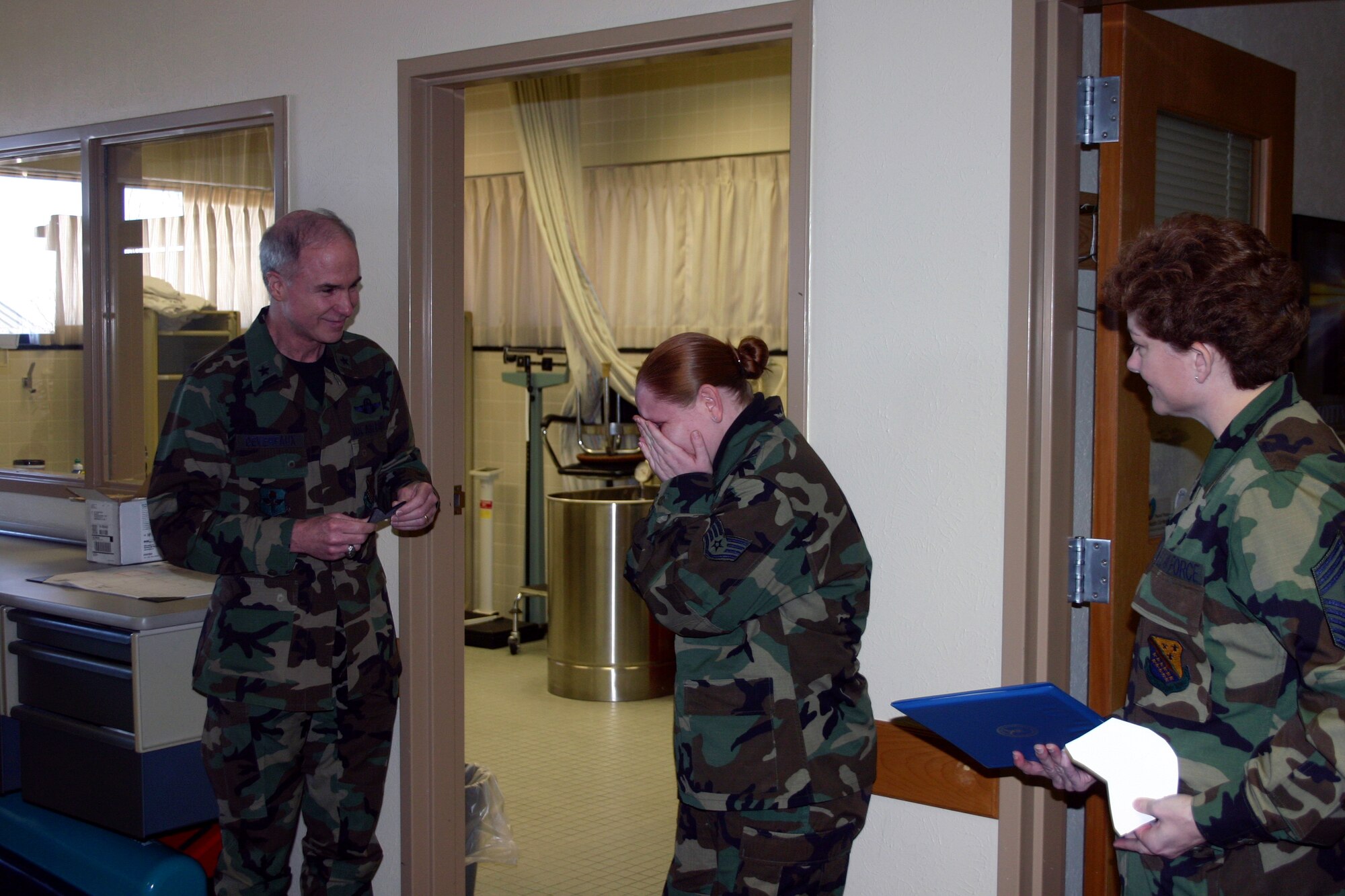 Staff Sgt. Holly Long, a physical education instructor for the 382nd Training Squadron, was STEP-promoted to technical sergeant Feb. 26.  With her students looking on, Tech. Sgt. Long was informed of her new status by 82nd Training Wing commander Brig. Gen. Richard Devereaux and 82nd TRW Command Chief Master Sgt. Jeannie McLean.  (U.S. Air Force Photo/Staff Sgt. Tonnette Thompson)