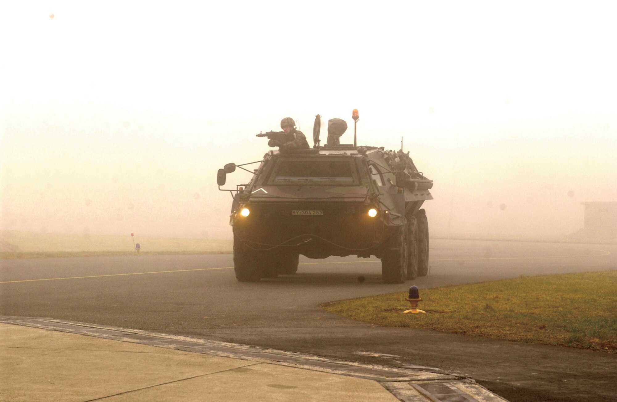 A German air force armored personnel carrier arrives on scene to participate in an exercise where U.S. and German troops recapture a protected aircraft shelter at Buechel Air Base, Germany, Feb. 21, 2007.  (U.S. Air Force photo by Senior Airman Kristin Ruleau) 