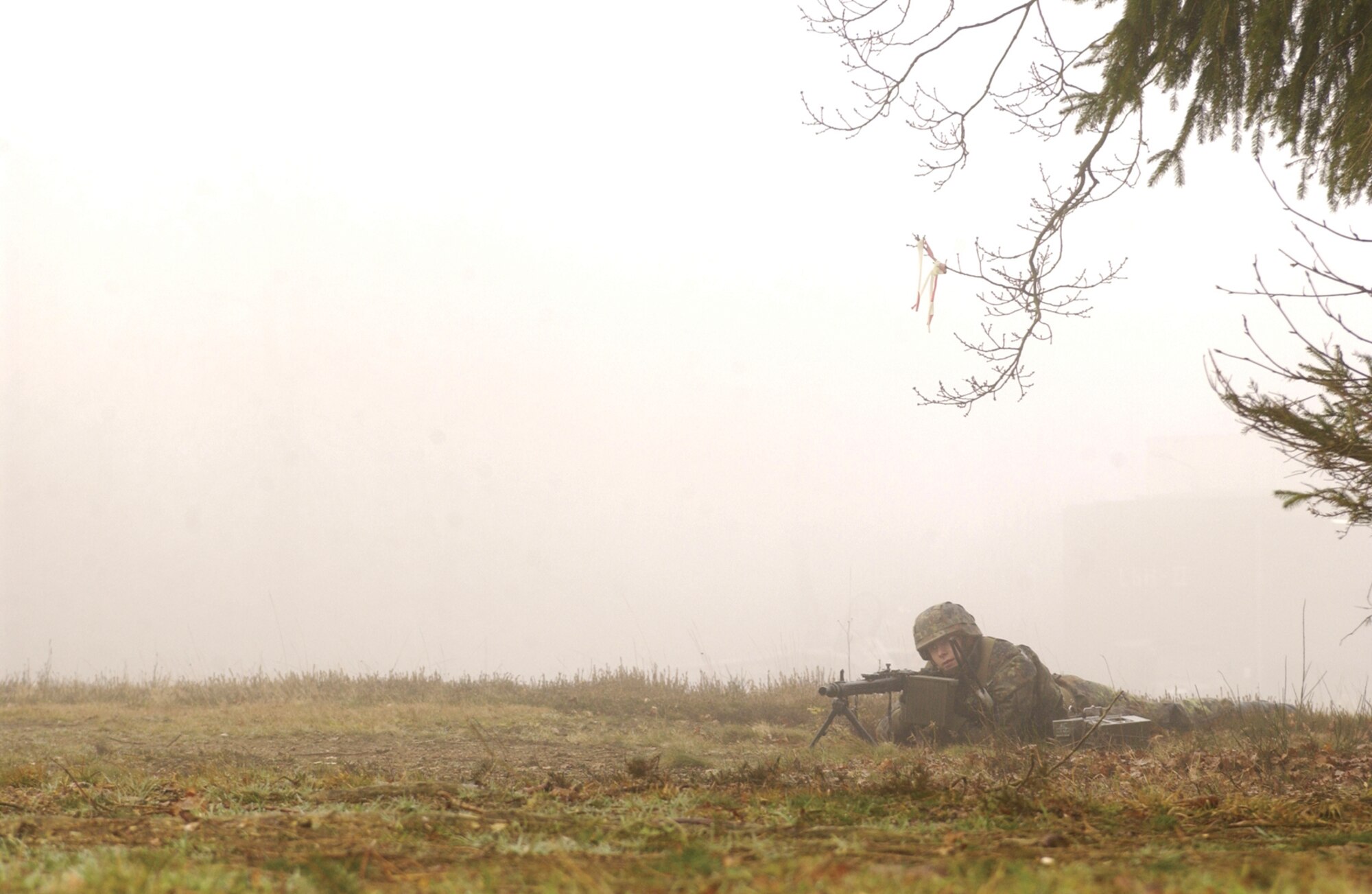 A German air force member provides cover during an exercise where U.S. and German troops work to recapture a protected aircraft shelter at Buechel Air Base, Germany, Feb. 21, 2007.  (U.S. Air Force photo by Senior Airman Kristin Ruleau) 