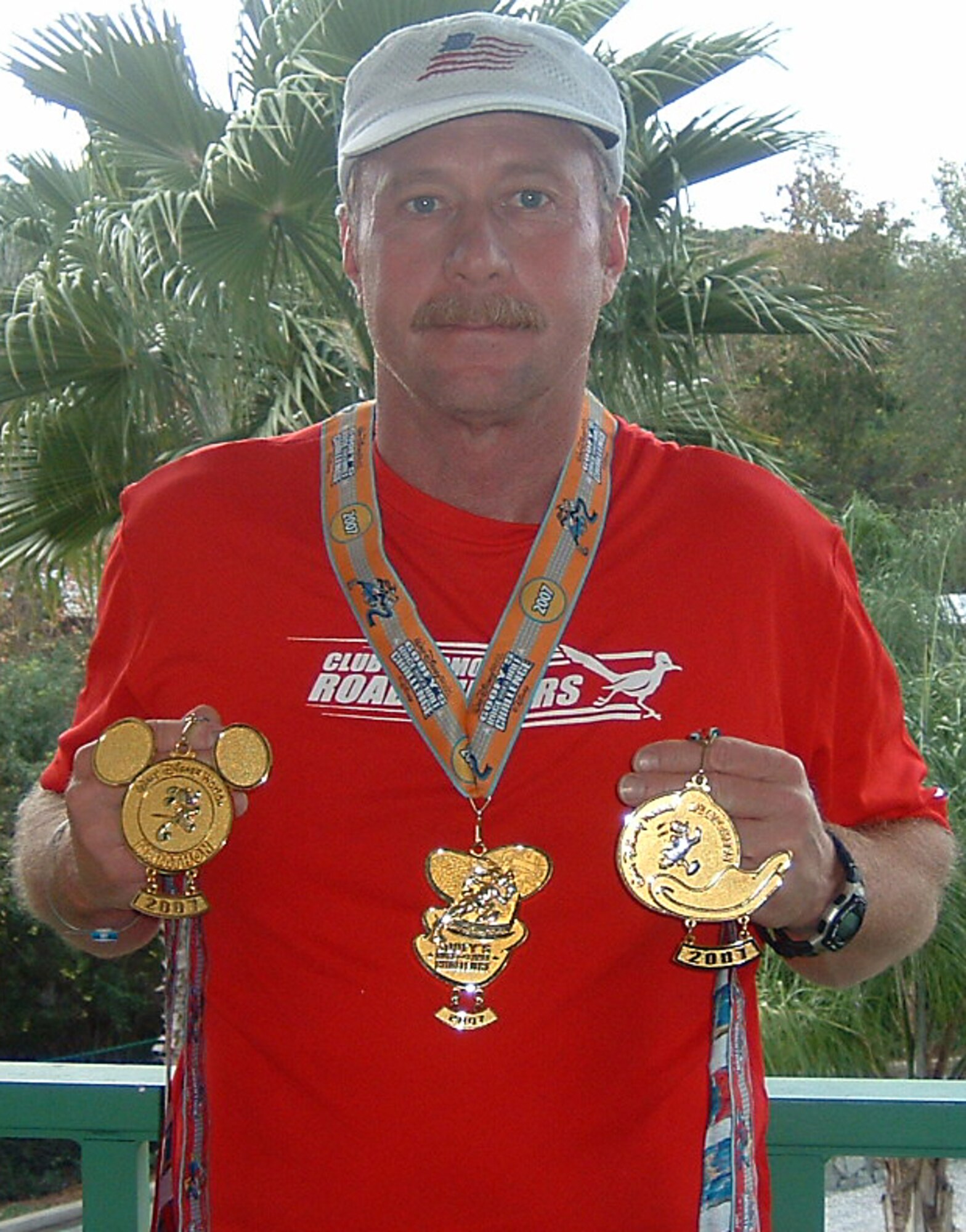 GRISSOM AIR RESERVE BASE, Ind., -- Master Sgt. Keith McAndrews displays his medals for walking in the Goofy Challenge at Walt Disney World, Florida recently. He recently participated in a two-day event at the famous theme park that consisted of a half marathon on the first day (finishing in 3:08:00; and a full marathon the next day (finishing 6:00:00). Sergeant McAndrews is a quality assurance inspector with the 434th Maintenance Group. (U.S. Air Force photo)