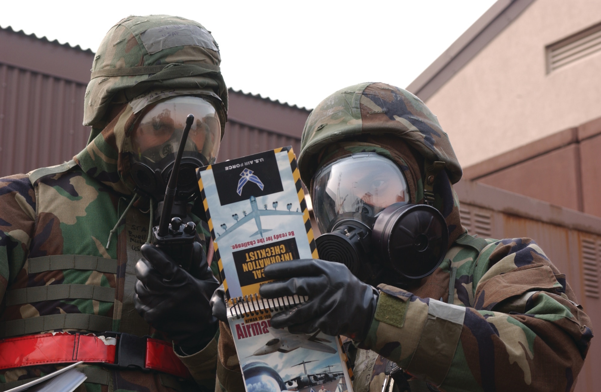 OSAN AIR BASE, Republic of Korea --  Senior Airmen Michael Buell and Giancarlo Delacruz identify an unexploded ordnance near the 36th Fighter Squadron here after conducting a sweep of the area during the Beverly Bulldog 07-02 Peninsula Operational Readiness Exercise. (U.S. Air Force photo by Airman Jason Epley)