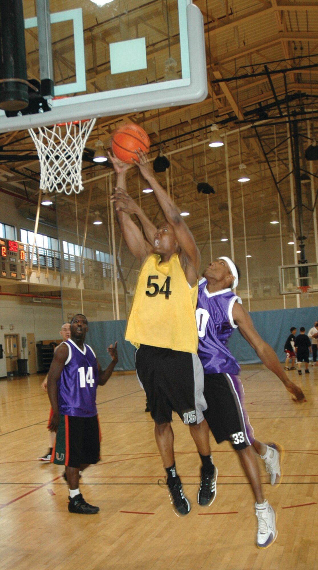 OSAN AIR BASE, Republic of Korea --  Jamie Sullivan goes for a layup with less than a minute left on the clock. His team went on to win the game  by one point. The African American Heritage Month committee, along with the Otis Hopkins Military Lodge and Order of Eastern Stars, sponsored the tournament. After everything was said and done, the tournament raised over $135 for the AAHMC. (U.S. Air Force photo by Senior Airman Brok McCarthy)