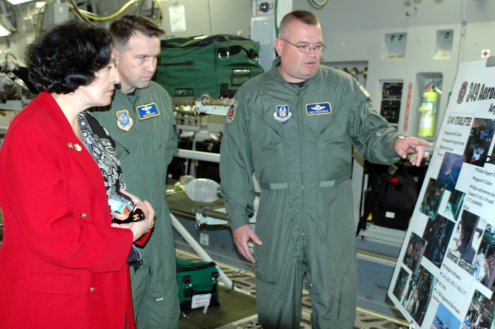 Senior Master Sgt. Charles Dowtin, 349th Aeromedical Evacuation Squadron, explains the 349th AES C-17 aeromedical evacuation mission to Ambassador Marcelle Wahba and Col. Tom Sharpy, 60th Air Mobility Wing vice commander, during the ambassador’s visit Feb. 23. In addition to meeting 349th AES personnel, the ambassador also met with personnel from the 60th Operations Support Squadron, the 60th Aerial Port Squadron and toured C-17, and C-5 aircraft. (U.S. Air Force photo by Staff Sgt. Candy Knight)