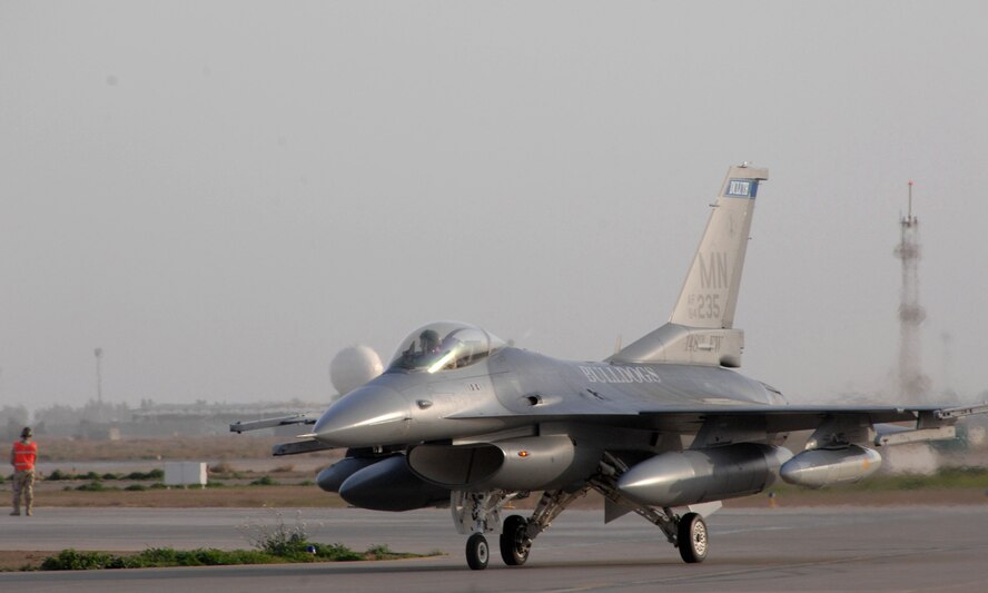 Major Mike Henkelman an F-16 Fighting Falcon pilot lands Feb. 26 in Balad Air Base, Iraq. Major Henkelman is from the 301st fighter wing in Fort Worth, Texas, but is an augmentee along with roughly 400 Air National Guardsmen from the Minnesota Air National Guard's 148th fighter wing deployed in support of Operation Iraqi Freedom. (U.S. Air Force photo/Tech. Sgt. Julie M. Tomaska) 