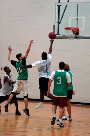 Bandish Smalls, SFS, goes in for a layup during Tuesday nights game versus AMXS1. (U.S. Air Force photo/Airman 1st Class Nicholas Pilch)