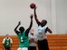 Mike Evans, 437th Security Forces Squadron, wins the jump ball at the start of the game over Sean Veney, 437th Security Forces Squadron. SFS trounced AMXS 65-34. (U.S. Air Force photo/Airman 1st Class Nicholas Pilch)