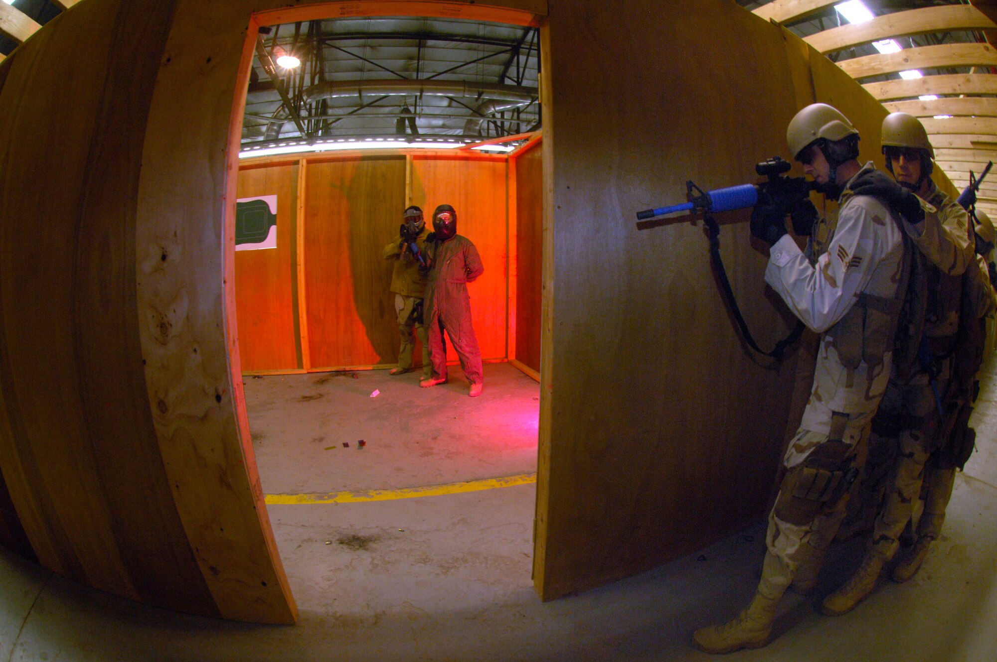 Airmen of the 90th Ground Training Squadron prepare to enter a room with a hostage situation in place Feb. 8 at Camp Guernsey, Wyo. Camp Guernsey is an Army Reserve training ground used by the 90th Space Wing for convoy security, sniper training and close quarters combat training including other specialty training. (U.S. Air Force photo/Senior Airman Javier Cruz Jr.)