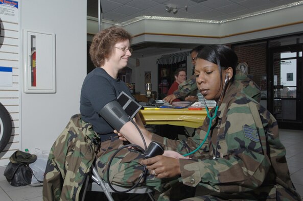 Col. Diane Hull, 319th Air Refueling Wing commander, has her blood pressure taken by Staff Sgt. Telicia Deberry, 319th Medical Group, during the Health Fair at the Base Exchange Feb. 24. The health fair provided information to the base community in honor of Black History Month. More than 100 people participated. (U.S. Air Force photo/Staff Sgt. Suellyn Nuckolls)