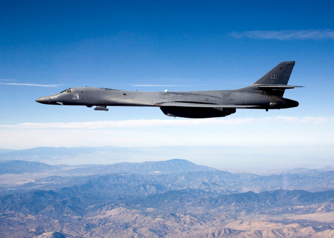 A B-1B Lancer carries the Sniper pod on its belly as it flies during a flight test Feb. 23 from Edwards Air Force Base, Calif. The 419th Flight Test Squadron testers recently concluded the initial development of the Sniper pod installed on a B-1B. The Sniper pod is an advanced targeting pod with a multi-sensor system that increases the aircraft's self-targeting capability. (U.S. Air Force photo/Steve Zapka)