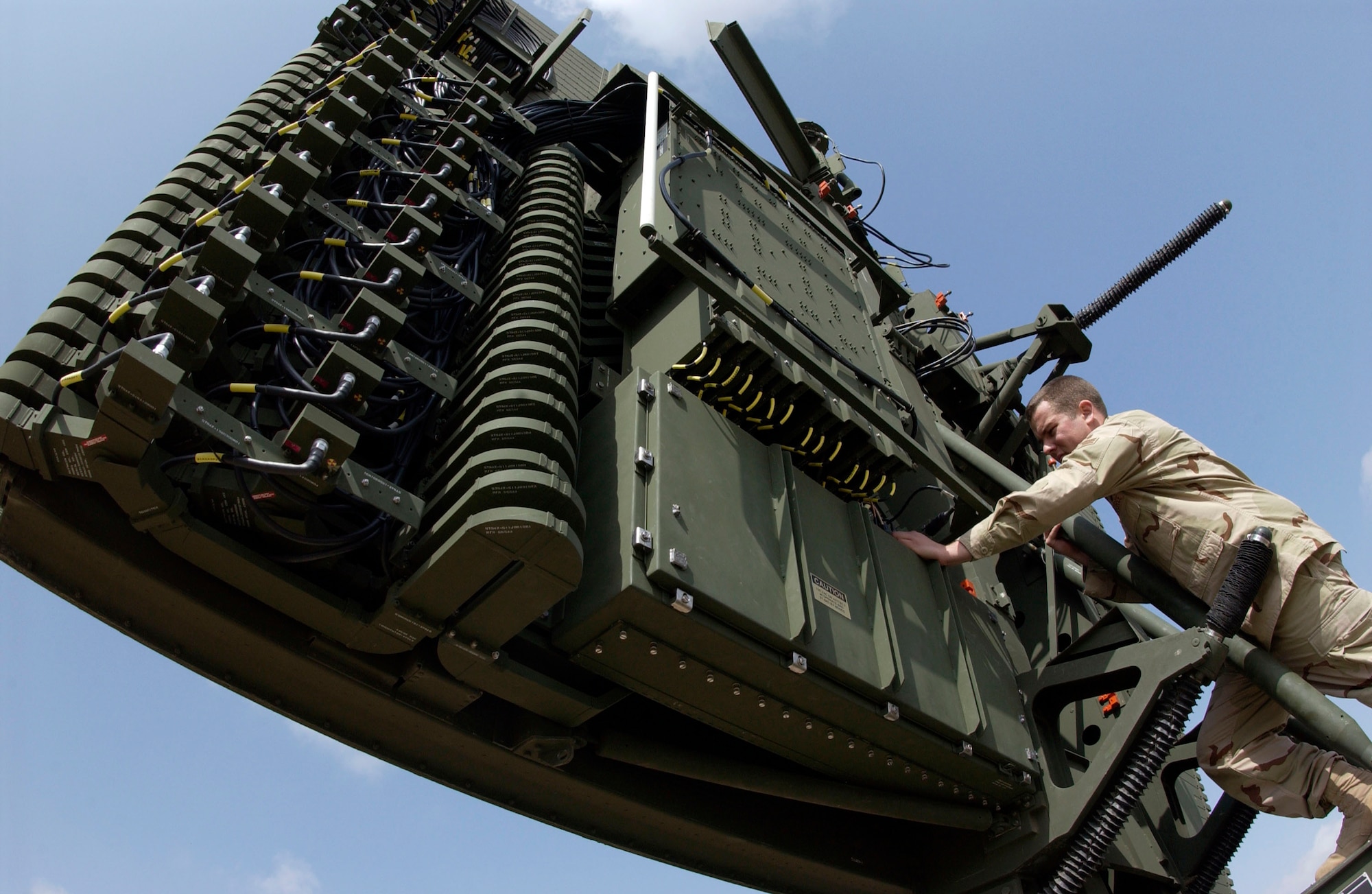 Senior Airman Justin Wagner performs a periodic maintenance inspection on an AN/TPS-75 air surveillance radar Feb. 27 at Kirkuk Air Base, Iraq. The AN/TPS-75 allows air battle managers located at Balad AB, Iraq, to remotely see aircraft flying in northern Iraq. Airman Wagner is a ground radar systems techinician with the 727th Expeditionary Air Control Squadron. (U.S. Air Force photo/Senior Airman Bradley A. Lail)