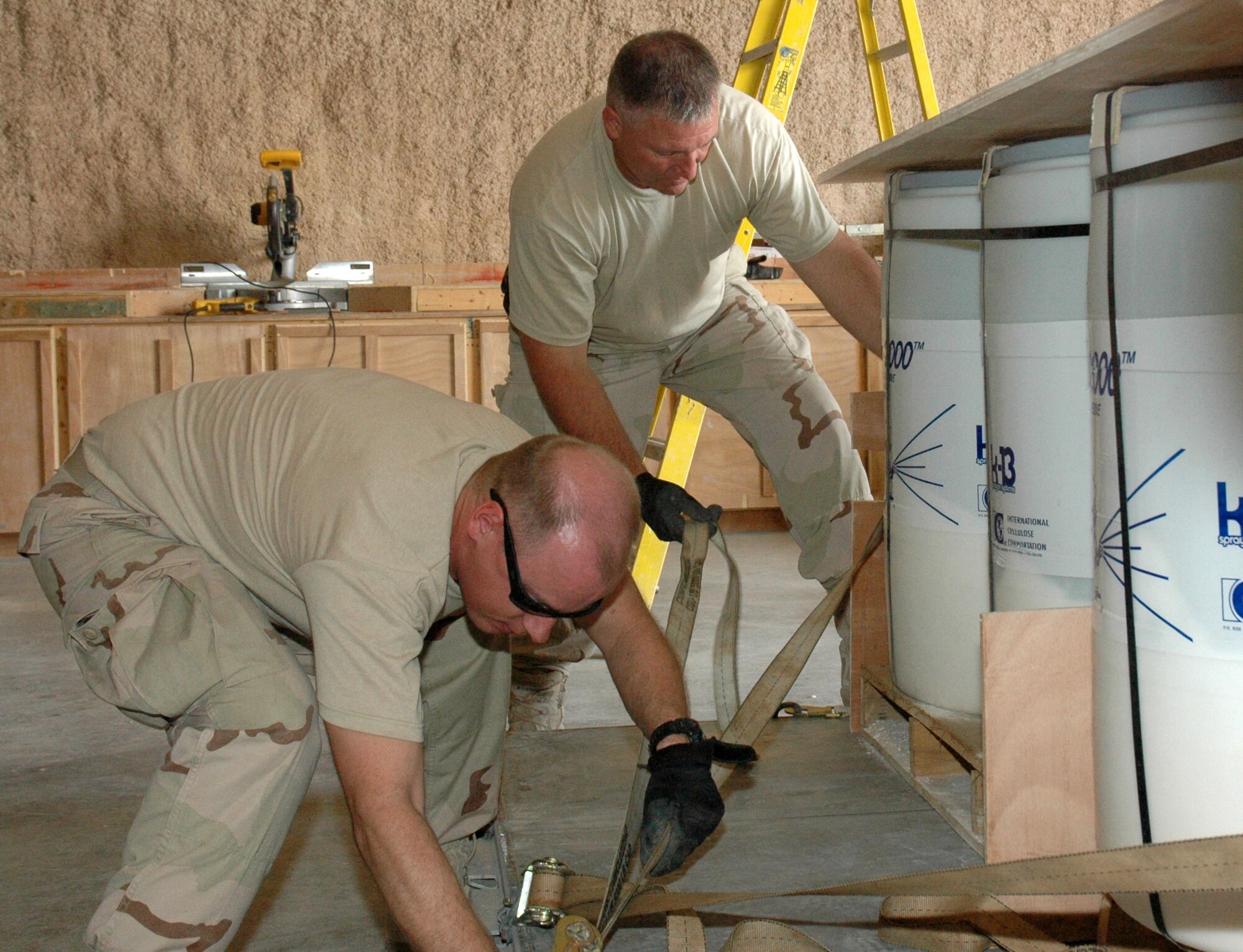 Airmen from the 1st Expeditionary RED HORSE Group palletize supplies to transport to Airmen in forward-deployed RED HORSE units throughout the area of responsibility Feb. 19 in Southwest Asia. (U.S. Air Force photo/Senior Airman Erik Hofmeyer) 