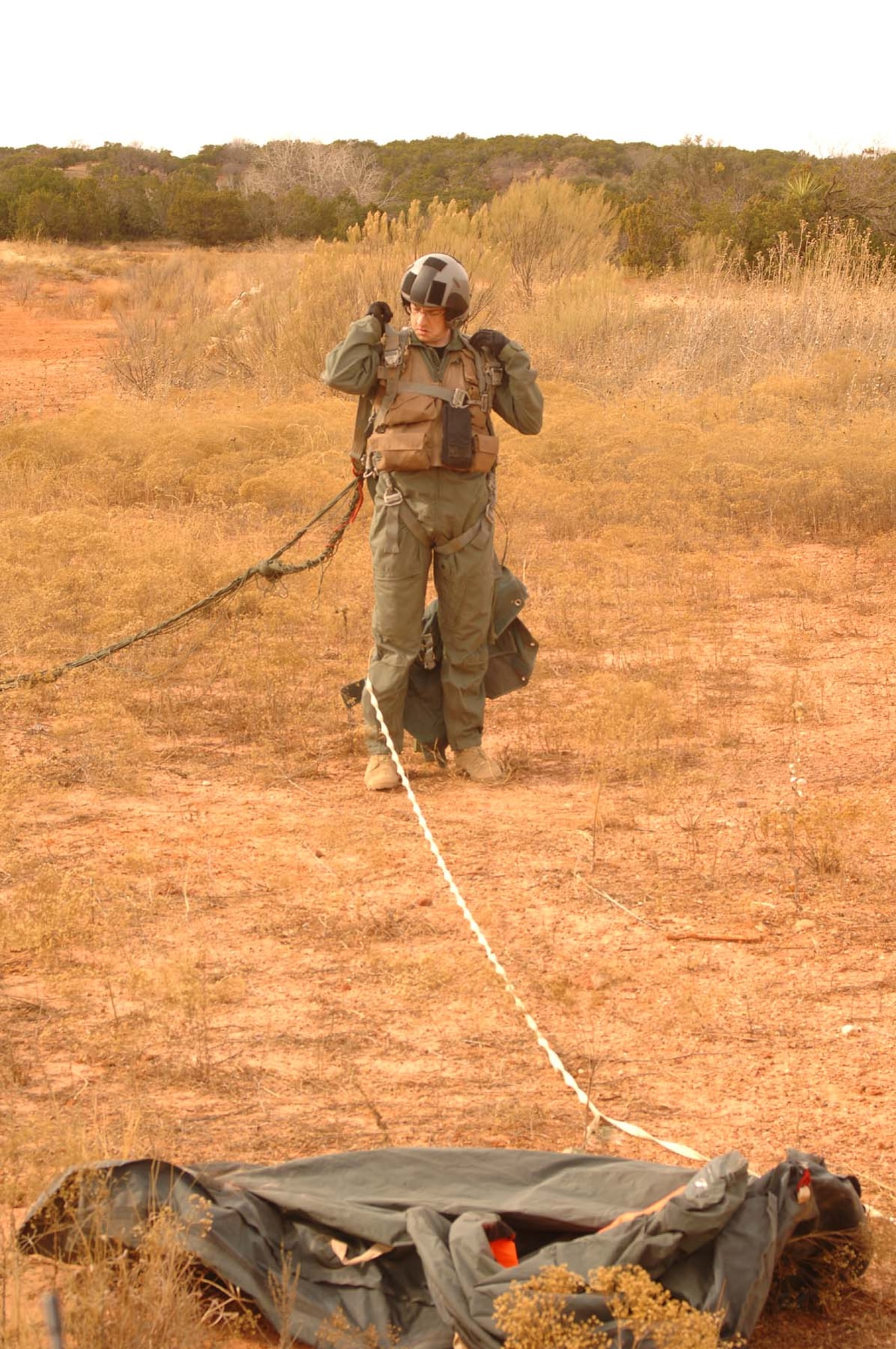 Staff Sgt. Bilse Schopfer, 317th Operations Support Squadron, aids Staff Sgt. Roger Zehr and Tech. Sgt. Ryan Sterling, 7th OSS, in conducting SERE training for Dyess aircrew last year. The training these noncommissioned officers conduct bi-weekly keeps aircrew mission-ready. (U.S. Air Force photo)